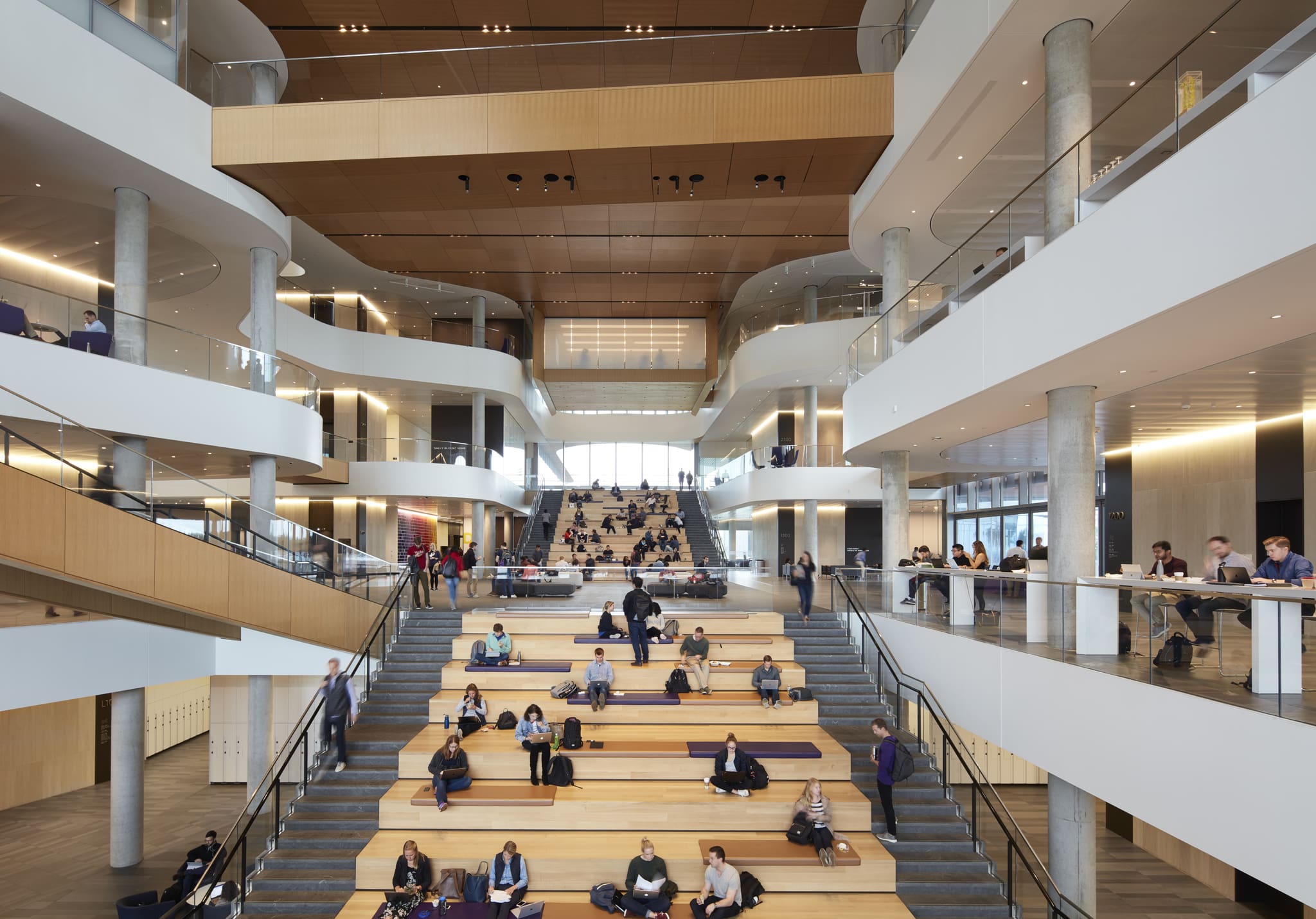 Students gathered on the Spanish Steps inside the Kellogg School of Management’s Global Hub, symbolizing global collaboration in MBA education.