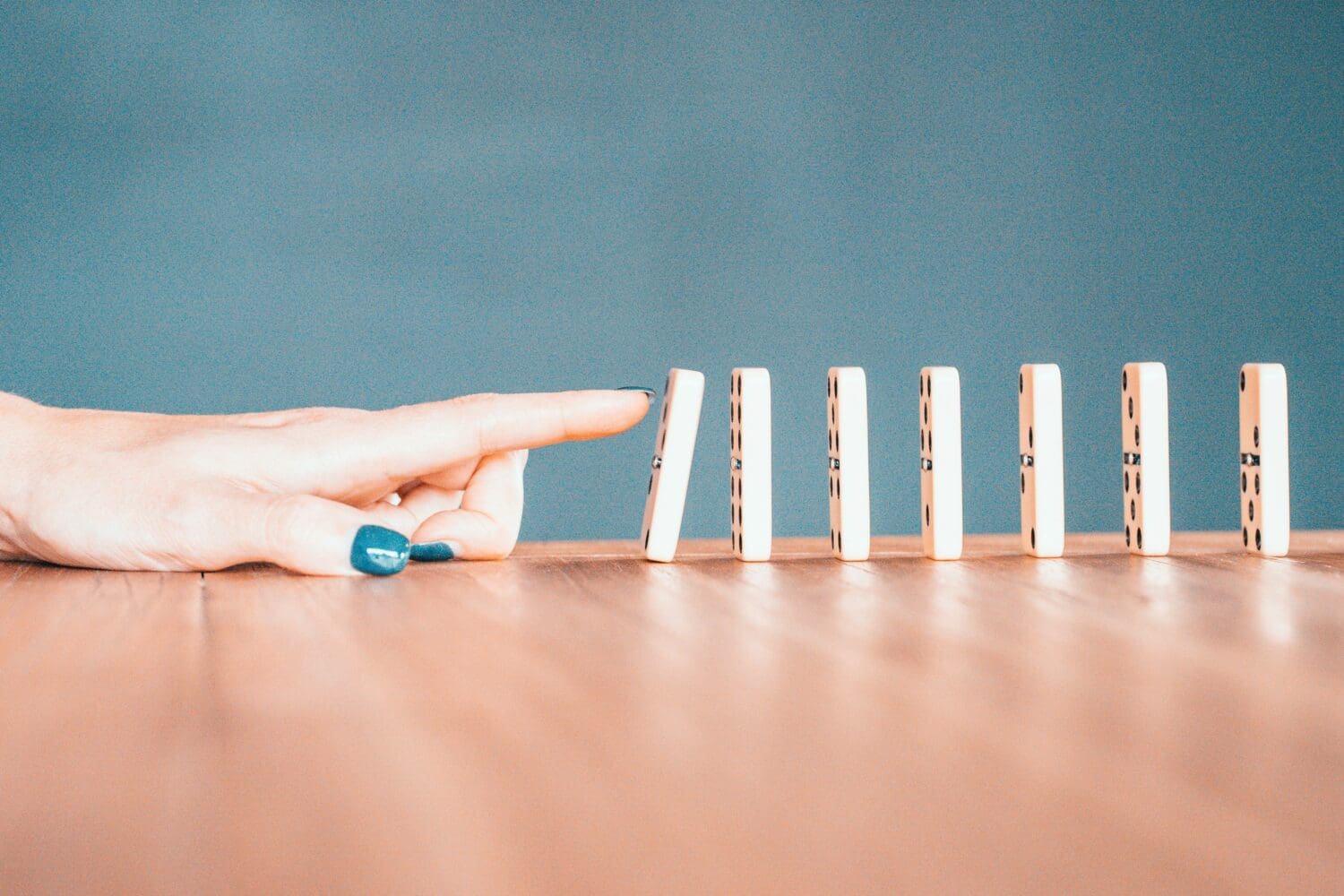 Domino effect symbolizing how small mistakes can create bigger problems during the admissions process.
