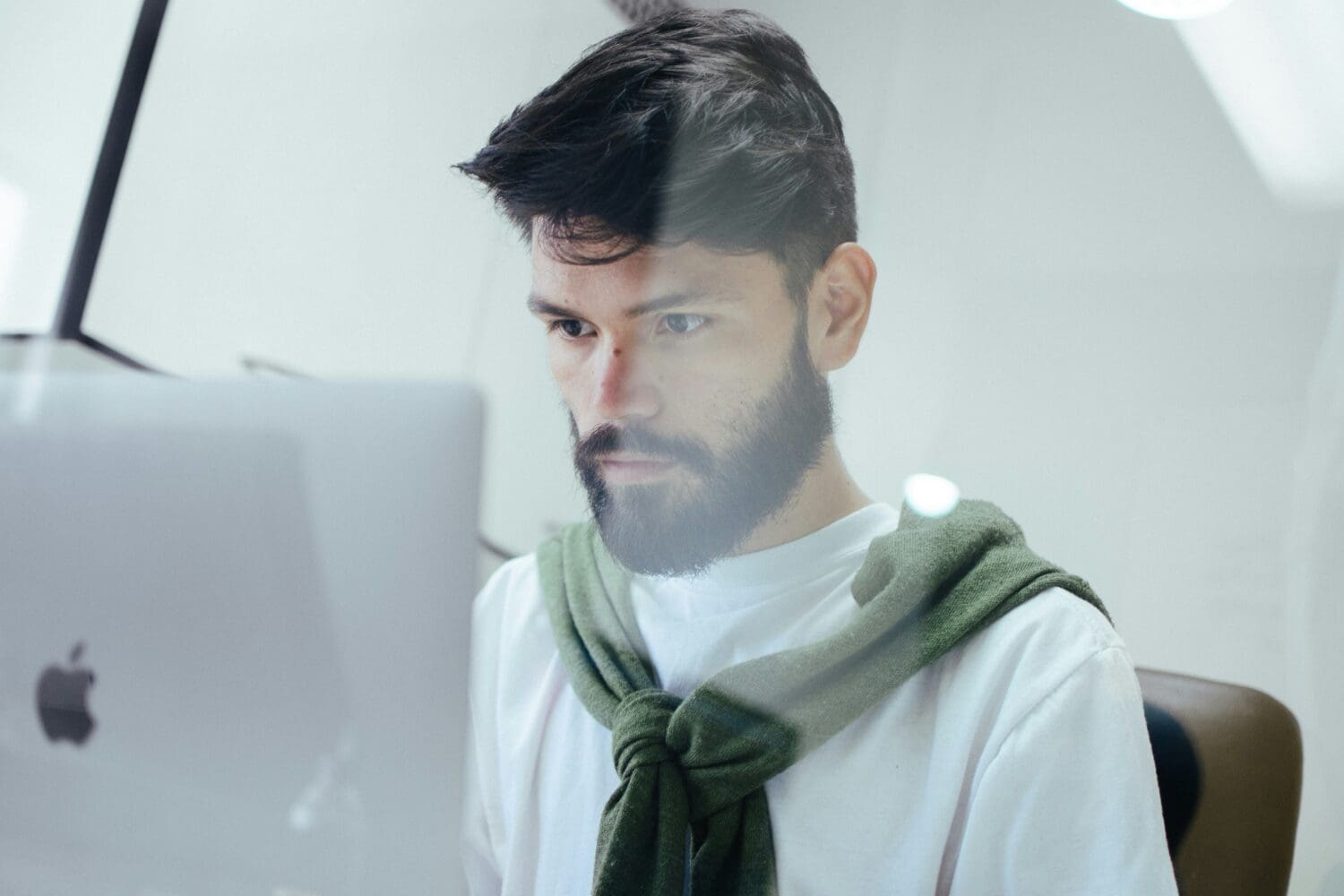 Professional evaluating Executive MBA ROI and tuition costs while working on a laptop.