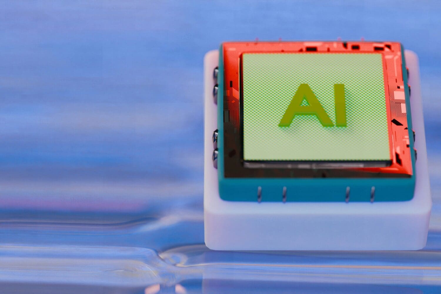 Computer chip labeled AI with an orange circuit frame, illustrating AI in MBA programs.