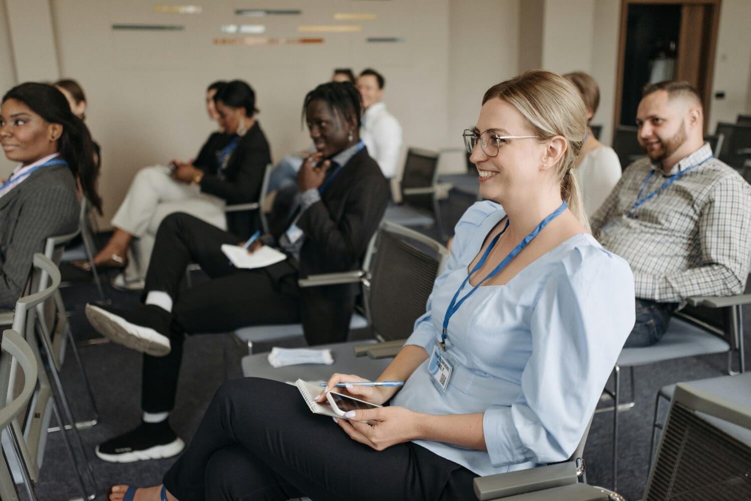 Executive MBA students building networks and learning from peers in a collaborative classroom environment.